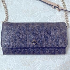 Michael Kors Jet Set large wallet on a chain
MK Signature crossbody